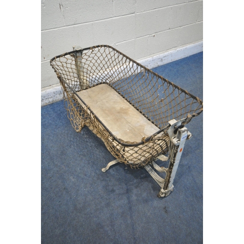 1410 - A VICTORIAN METAL FOLDING TRAVEL ROCKING CRIB (condition report: loose rope, some rust, losses to pa... 