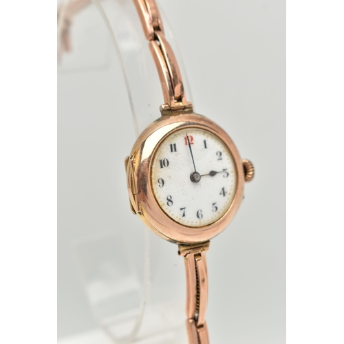 11 - AN EARLY 20TH CENTURY LADIES WRISTWATCH, hand wound movement, round dial, Arabic numerals, rose gold... 