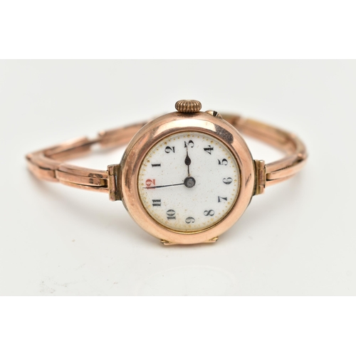 11 - AN EARLY 20TH CENTURY LADIES WRISTWATCH, hand wound movement, round dial, Arabic numerals, rose gold... 