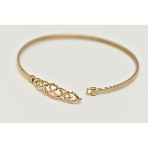 17 - A 9CT GOLD BANGLE, a Celtic design light weight bangle, fitted with a hook fastening, hallmarked 9ct... 