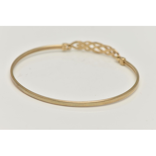 17 - A 9CT GOLD BANGLE, a Celtic design light weight bangle, fitted with a hook fastening, hallmarked 9ct... 