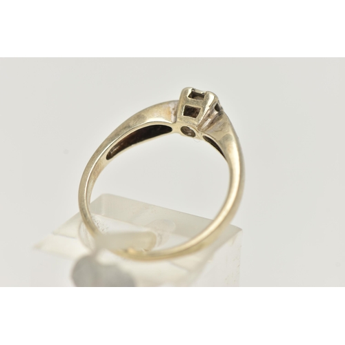 27 - A 9CT GOLD SINGLE STONE DIAMOND RING, designed as a brilliant cut diamond within a square illusion s... 