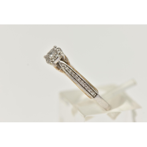 29 - A 9CT WHITE GOLD DIAMOND RING, designed as a central brilliant cut diamond within a brilliant cut di... 