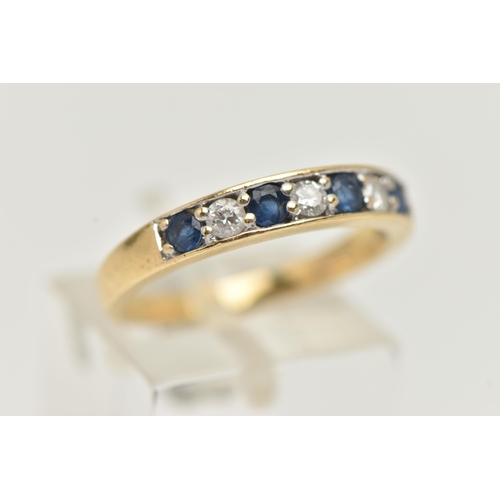 31 - AN 18CT GOLD SAPPHIRE AND DIAMOND SEVEN STONE RING, designed as a line of four circular sapphires in... 