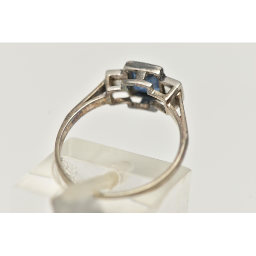 33 - A SAPPHIRE AND DIAMOND RING, designed as a central rectangular cut treated sapphire in milligrain se... 