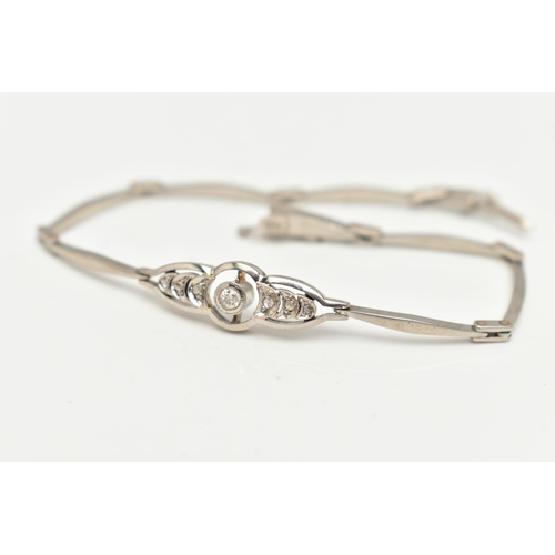 42 - A DIAMOND BRACELET, the central openwork panel set with an old cut diamond flanked by three rose cut... 