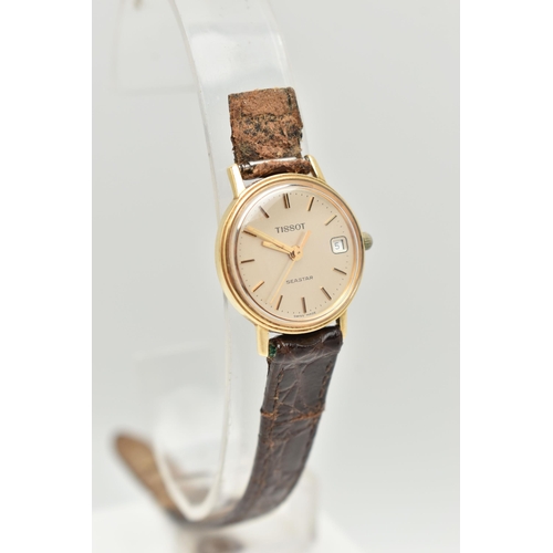 59 - A LADIES 'TISSOT' WRISTWATCH, round gold tone dial signed 'Tissot Seastar', baton markers, date wind... 