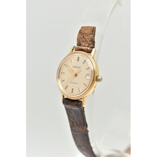 59 - A LADIES 'TISSOT' WRISTWATCH, round gold tone dial signed 'Tissot Seastar', baton markers, date wind... 