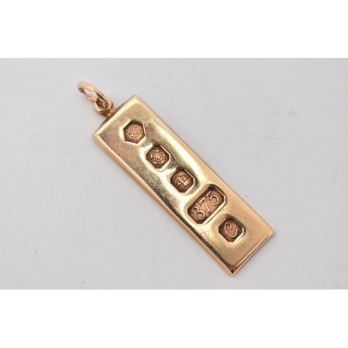 114 - A 9CT GOLD INGOT PENDANT, a rectangular form pendant with decorative hallmarks, approximate length 4... 