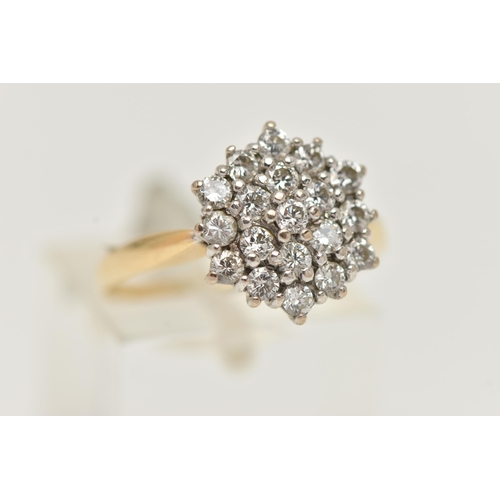 123 - A YELLOW METAL DIAMOND CLUSTER RING, cluster set with round brilliant cut diamonds, estimated total ... 