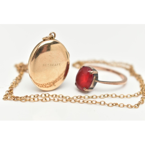 134 - A YELLOW METAL RING, CHAIN AND OVAL LOCKET, the ring set with a rubbed and worn, oval cut red paste,... 