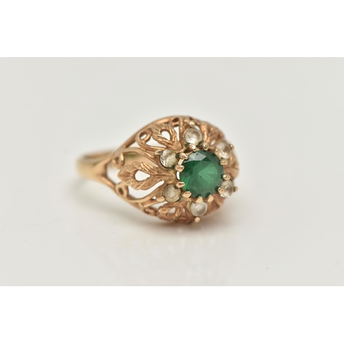 70 - A 9CT GOLD GEM SET RING, the central circular gem possibly a soude emerald, with circular colourless... 