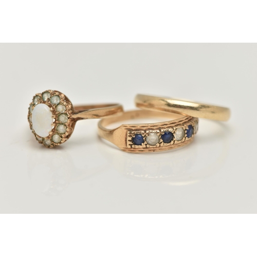 75 - THREE 9CT GOLD GEM SET RINGS, to include an opal and colourless gem cluster ring, a seven stone sapp... 