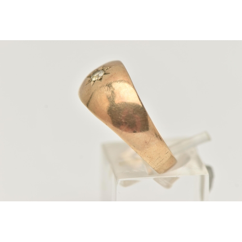 95 - A GENTS 9CT GOLD SIGNET RING, set with a circular cut colourless spinel, in a star setting, polished... 