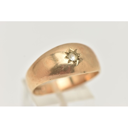 95 - A GENTS 9CT GOLD SIGNET RING, set with a circular cut colourless spinel, in a star setting, polished... 