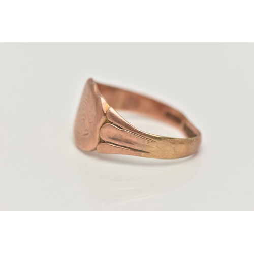 96 - A GENTS 9CT ROSE GOLD SIGNET RING, engraved shield signet, textured shoulders leading onto a misshap... 