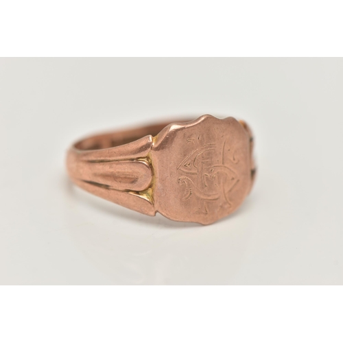 96 - A GENTS 9CT ROSE GOLD SIGNET RING, engraved shield signet, textured shoulders leading onto a misshap... 