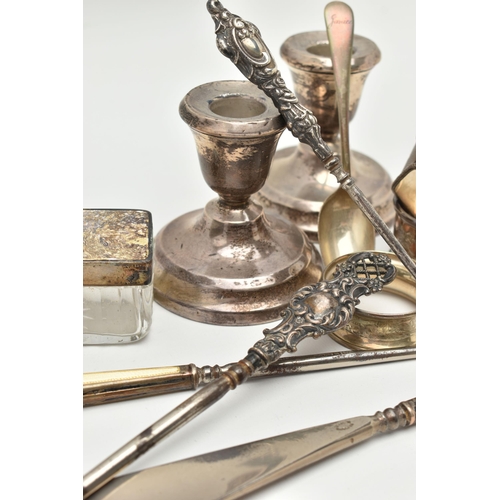 175 - ASSORTED SILVER ITEMS, to include a pair of silver dwarf candle sticks, on round weighted bases, hal... 