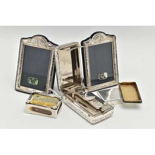 176 - A SMALL PARCEL OF SILVER, a pair of Elizabeth II rectangular easel back photograph frames, foliate d... 