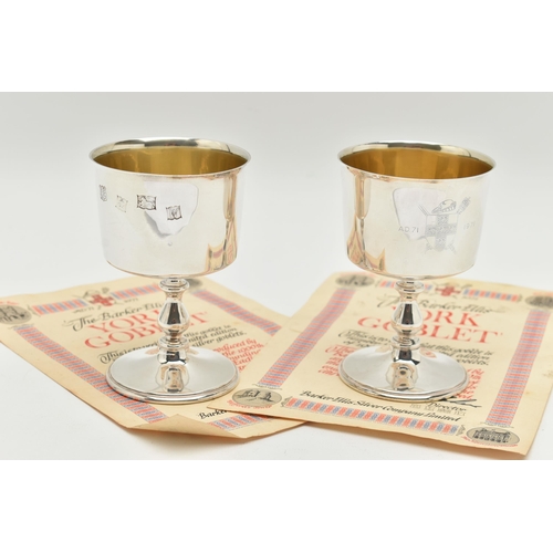 182 - A PAIR OF ELIZABETH II SILVER GOBLETS, polished cups engraved with a family crest inscribed 'A.D.71 ... 