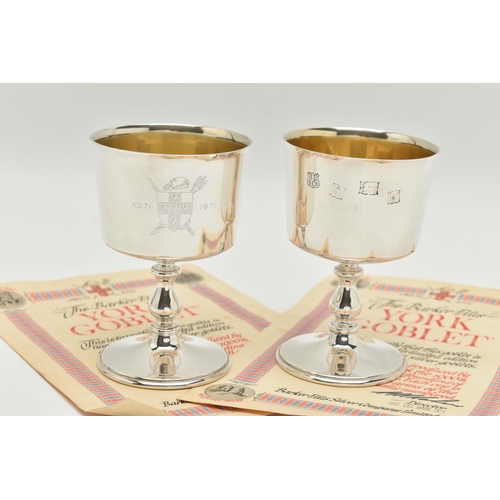 182 - A PAIR OF ELIZABETH II SILVER GOBLETS, polished cups engraved with a family crest inscribed 'A.D.71 ... 