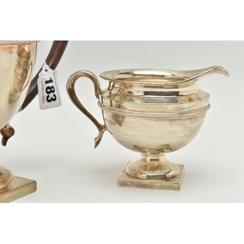 183 - AN EARLY 20TH CENTURY SILVER THREE PIECE TEA SET, comprising of a teapot, sugar bowl and milk jug, e... 