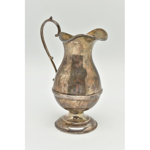 184 - A GEORGE V SILVER CREAM JUG, a baluster form jug with a scrolling handle, approximate height 145mm, ... 