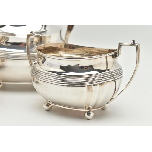 192 - A GEORGE V SILVER FOUR PIECE TEA SERVICE OF SHAPED RECTANGULAR FORM, reeded horizonal band detail an... 