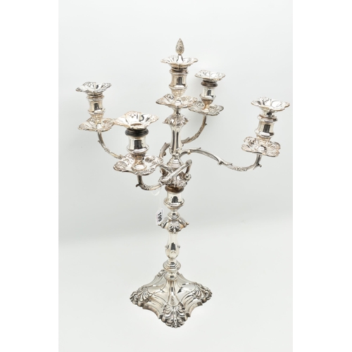 199 - A GEORGE V SILVER FIVE LIGHT CANDELABRUM IN GEORGE II STYLE, with removable shaped square drip pans,... 