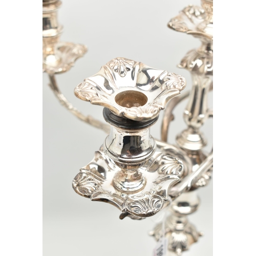 199 - A GEORGE V SILVER FIVE LIGHT CANDELABRUM IN GEORGE II STYLE, with removable shaped square drip pans,... 