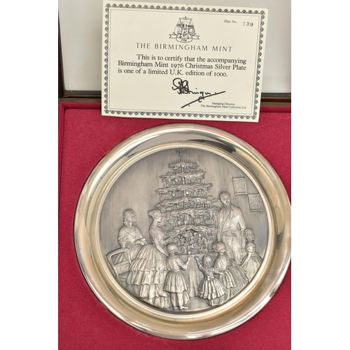 200 - THREE ELIZABETH II SILVER BIRMINGHAM MINT LIMITED EDITION CHRISTMAS PLATES, 1975-1977, repoussé deco... 