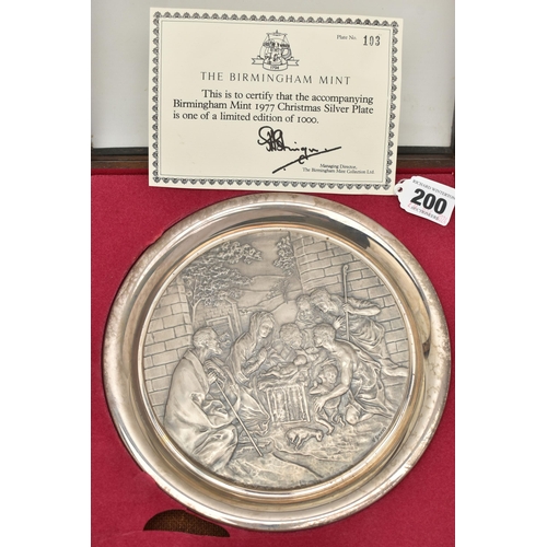 200 - THREE ELIZABETH II SILVER BIRMINGHAM MINT LIMITED EDITION CHRISTMAS PLATES, 1975-1977, repoussé deco... 