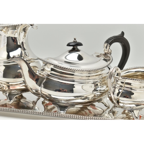 201 - A FOUR PIECE SILVER PLATED TEA SET WITH TRAY, comprising of a polished teapot, coffee pot, sugar bow... 