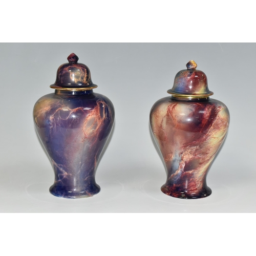 302 - TWO WILKINSON'S ROYAL STAFFORDSHIRE ORIFLAMME COVERED GINGER JARS, of similar baluster form, with pu... 