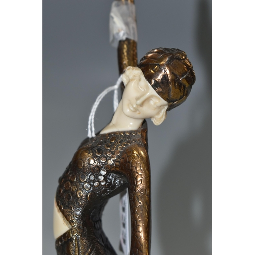 333 - AN ART DECO STYLE FIGURE, the female dancer surmounting a stepped geometric base, total height appro... 