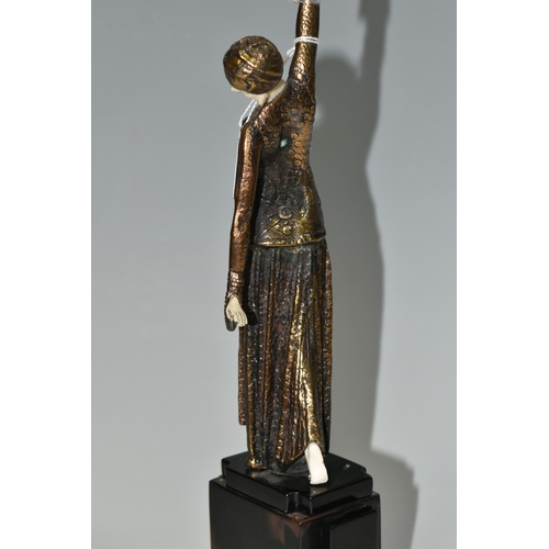 333 - AN ART DECO STYLE FIGURE, the female dancer surmounting a stepped geometric base, total height appro... 