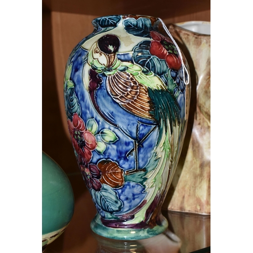 334 - A GROUP OF FOUR VASES, comprising a Thomas Forrester Trogon Ware vase tube lined with an exotic bird... 