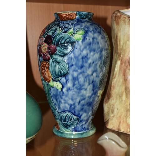 334 - A GROUP OF FOUR VASES, comprising a Thomas Forrester Trogon Ware vase tube lined with an exotic bird... 