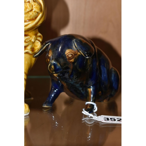 352 - A MAJOLICA PIG MONEY BOX AND DOG FIGURE, comprising navy blue and brown glazed pig money box with a ... 