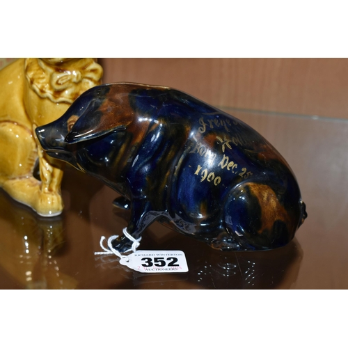 352 - A MAJOLICA PIG MONEY BOX AND DOG FIGURE, comprising navy blue and brown glazed pig money box with a ... 