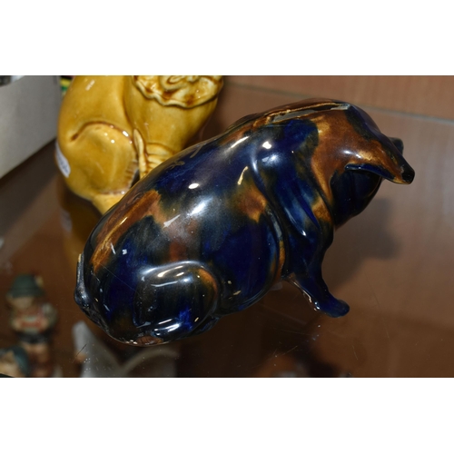 352 - A MAJOLICA PIG MONEY BOX AND DOG FIGURE, comprising navy blue and brown glazed pig money box with a ... 