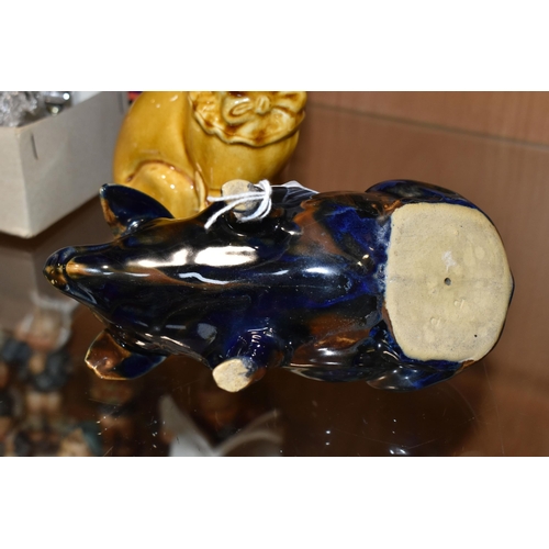 352 - A MAJOLICA PIG MONEY BOX AND DOG FIGURE, comprising navy blue and brown glazed pig money box with a ... 