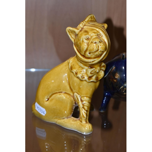 352 - A MAJOLICA PIG MONEY BOX AND DOG FIGURE, comprising navy blue and brown glazed pig money box with a ... 