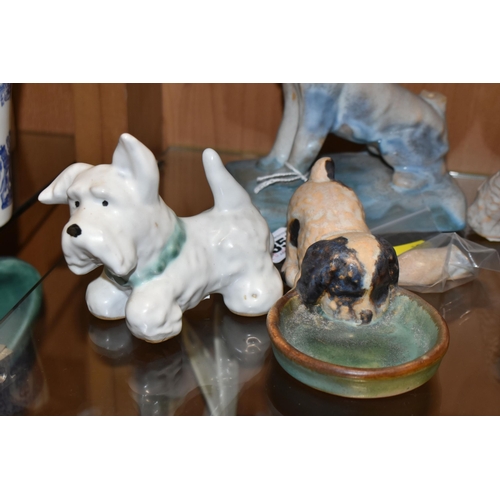 355 - FOUR BOURNE DENBY DOGS c1930, comprising a Danesby Ware bookend in the form of a terrier (broken tai... 