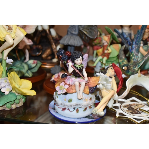 357 - A COLLECTION OF WEST GERMAN GOEBEL FIGURES AND FLOWER FAIRY ORNAMENTS, comprising a small plaque Hum... 