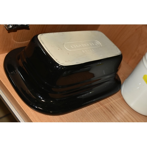 359 - THREE PIECES OF LE CREUSET KITCHENWARE, comprising a black Le Creuset oven dish 13-28, a cream utens... 