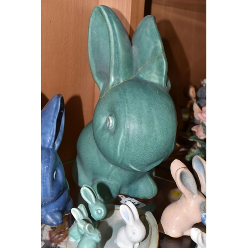 364 - A GROUP OF BOURNE DENBY RABBITS, comprising a very large Marmaduke green  snub nose rabbit (badly da... 