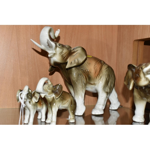 369 - A GROUP OF FIVE ROYAL DUX PORCELAIN GRADUATED ELEPHANTS, one has an applied pink Royal Dux triangle ... 