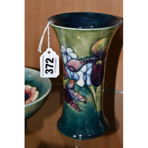 372 - A GROUP OF MOORCROFT POTTERY, comprising a Moorcroft  'Orchid' design vase on a green ground with im... 