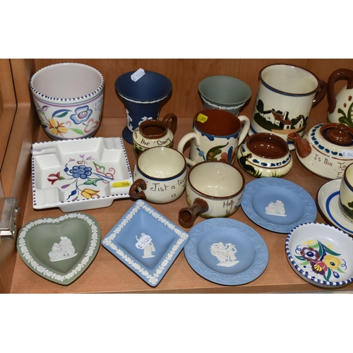 380 - A COLLECTION OF NAMED CERAMICS, comprising two Art Pottery chamber sticks, six pieces of Wedgwood bl... 